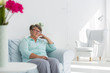 © Photographee.eu - Senior woman sitting on sofa
