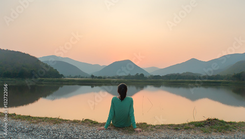Fotografía An Asian woman social distancing in sunset by the lake