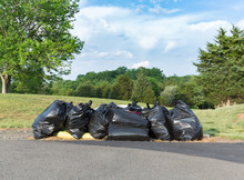 Many Black Plastic Bags Of Trash Or Rubbish