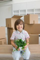 Little cute boy in empty room, remoove to new house home alone b