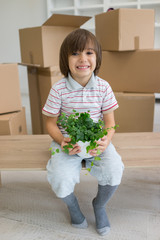 Little cute boy in empty room, remoove to new house home alone b