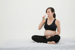© Voradech Triniti - Pregnant Woman Sitting and Drinking Milk