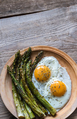 Wall Mural - Roasted asparagus with fried eggs