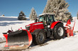 Red tractor for snow removal