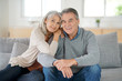 © goodluz - Portrait of senior couple relaxing in sofa