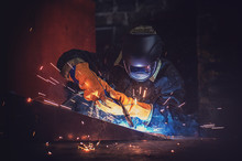 Worker Welding Metal