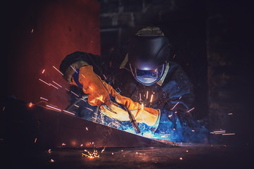 worker welding metal