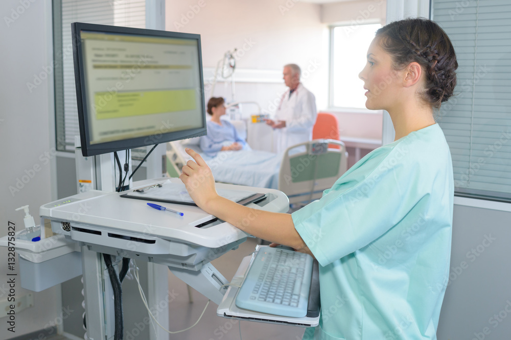 Nurse using computer Stock Photo | Adobe Stock