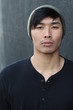 © ajr_images - Asian man with lip ring and beanie