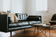 © Paige French - Leather sofa in living room