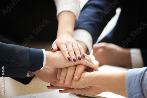 Fototapeta na szkło United hands of business team, close up