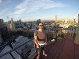 Fototapeta Londyn - Man taking a selfie with Sydney Skyline on background, Australia