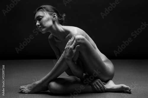Fotografie, Obraz Naked woman body sculpture. Fine art photo of female body.