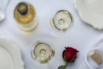 Wall Mural - White Wine with a Bottle, Cork and a Rose on a White Linen