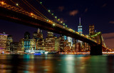 Fototapeta  - Brooklyn Bridge at dusk viewed from the Park in New York City.