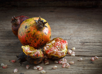 Pomegranate  on wooden background.