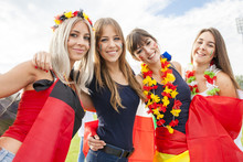 Female Soccer Fans With Different National Flags