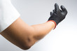 © bonnontawat - A hand wearing black glove