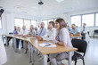 © Lumi Images - Audience in training class listening to speaker