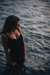 © lovevision - Seductive model in the dress standing in the sea water