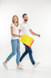 © LIGHTFIELD STUDIOS - Couple walking with shopping bags