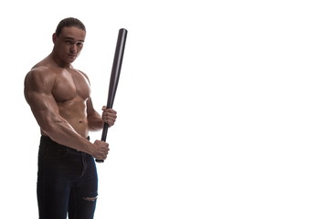 Portrait of a brutal man bodybuilder athlete with naked torso with a baseball bat in his hands on a white background