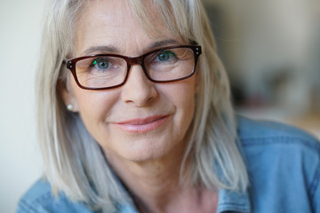 Wall Mural - Portrait of senior woman with eyeglasses