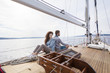 © Lumi Images - Young couple on yacht sitting back to back