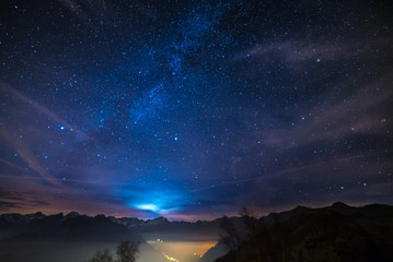 night on the alps under starry sky and moonlight