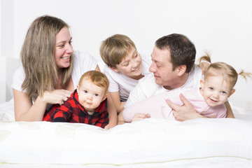 Wall Mural - five member Young Family Having Fun In Bed