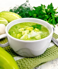 Poster - Soup cucumber with parsley in white bowl on board