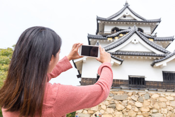 Sticker - Woman taking photo on Hikone castle