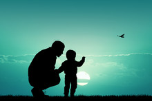 Father With Child At Sunset