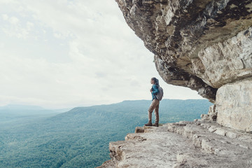 Canvas Print - Traveler standing on cliff