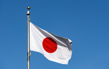 Japanese Flag In The Wind Against The Sky, Tokyo