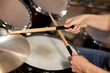 © Syda Productions - male musician playing drums and cymbals at concert