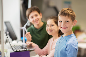 Wall Mural - children with laptop and wind turbine at school