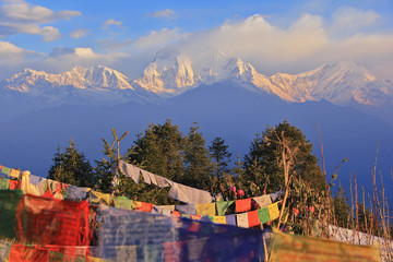 Wall Mural - Prayer flags with snowy mountain in the morning at poon hill, Ne