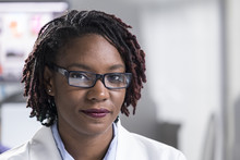 Portrait Of A Young Black Woman In A Lab Coat
