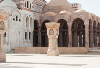 View of the tower of the ancient mosque. Mosque entrance ornament. Islamic ornaments on wall. Arab symbols. Al Mustafa Mosque Sharm El Sheikh. Ancient wall