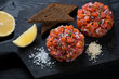 Close-up of fresh salmon tartar topped with black sesame seeds