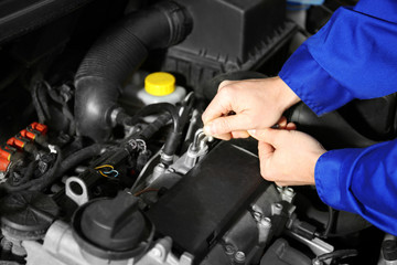 Wall Mural - Mechanic repairing car with open hood