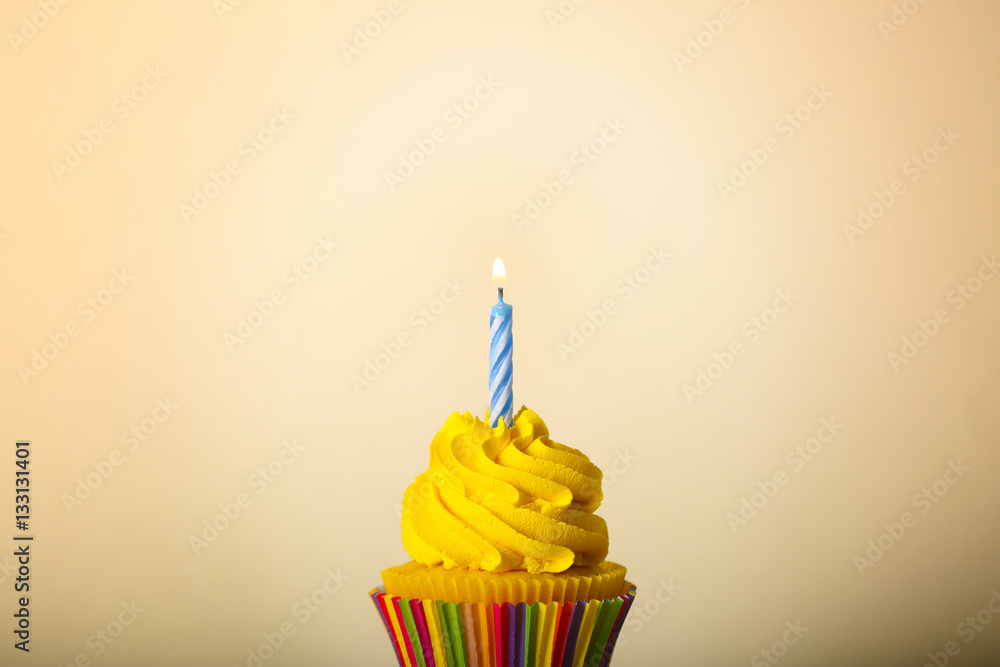 Tasty cupcake on color background