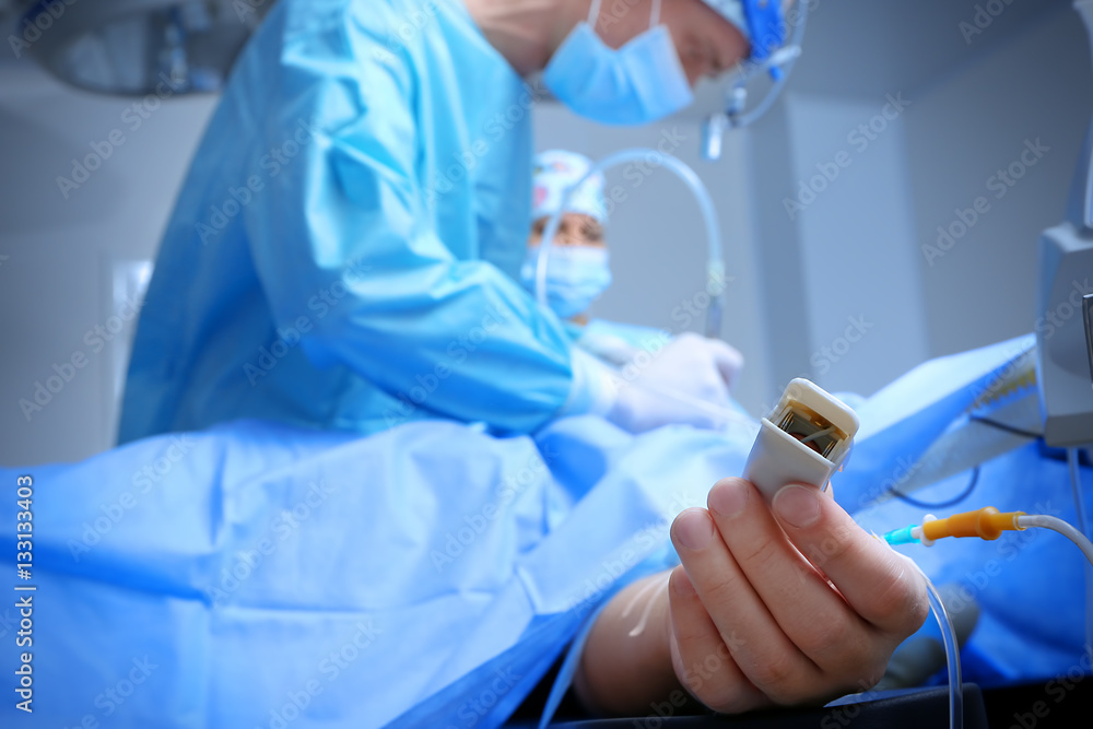 Operation of patient in modern hospital