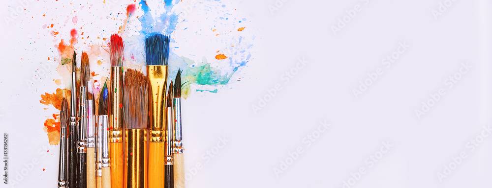 artistic brushes on wooden background - obrazy, fototapety, plakaty 