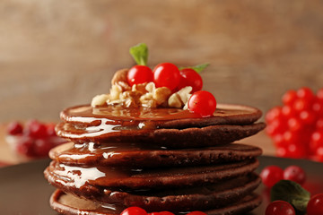 Sticker - Tasty chocolate pancakes with  viburnum and nuts, closeup