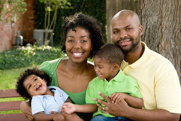 Happy African American family with their baby.