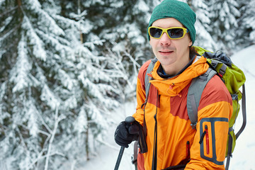 Wall Mural - hiker with backpack on the trail in the Carpathians mountains at winter