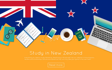 Study in New Zealand concept for your web banner or print materials. Top view of a laptop, books and coffee cup on national flag. Flat style study abroad website header.