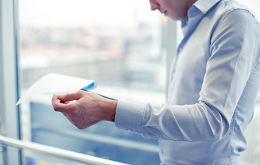 Wall Mural - businessman with clipboard and papers in office